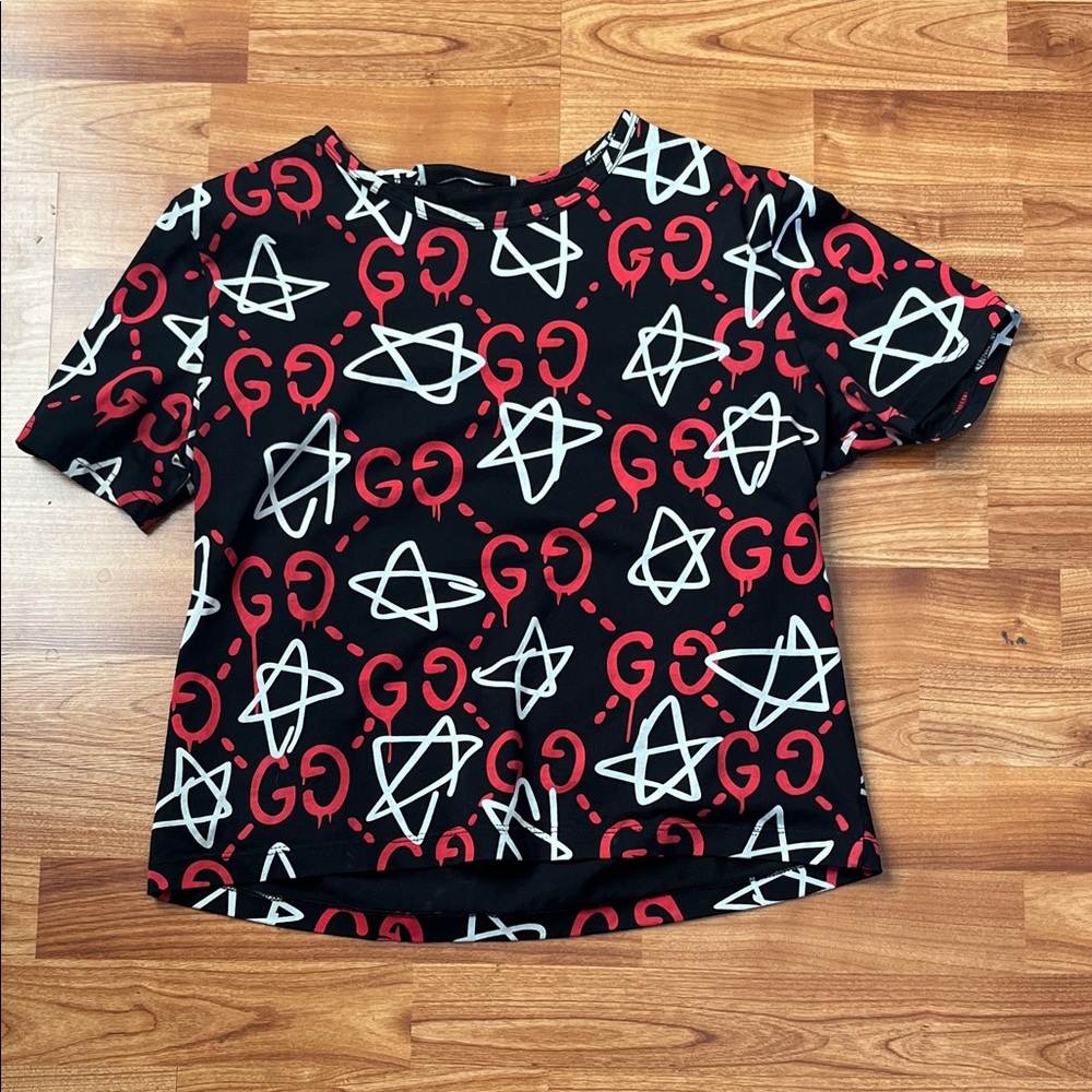 Black Graphic Tee with Red and White Patterns